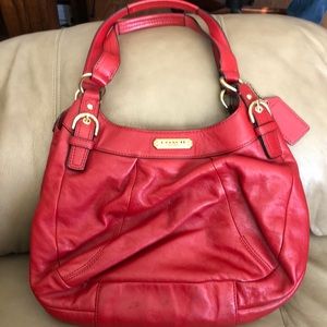 Women’s red Coach purse